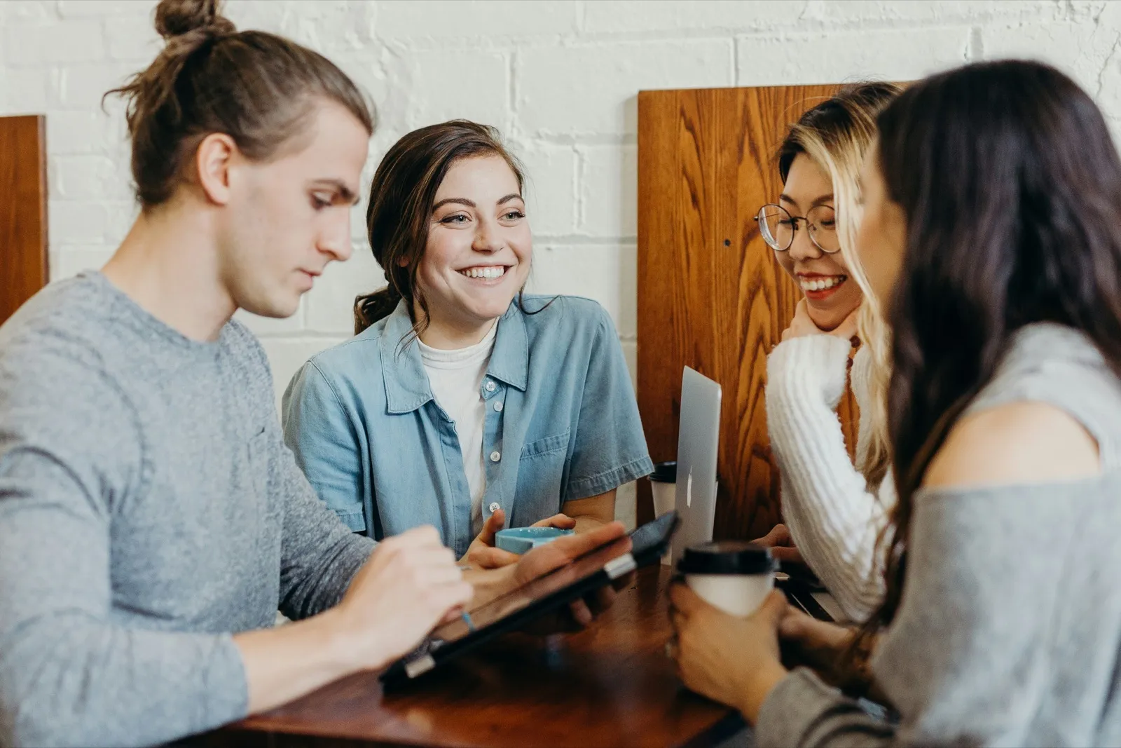 A group of friends listening to one another during a conversation